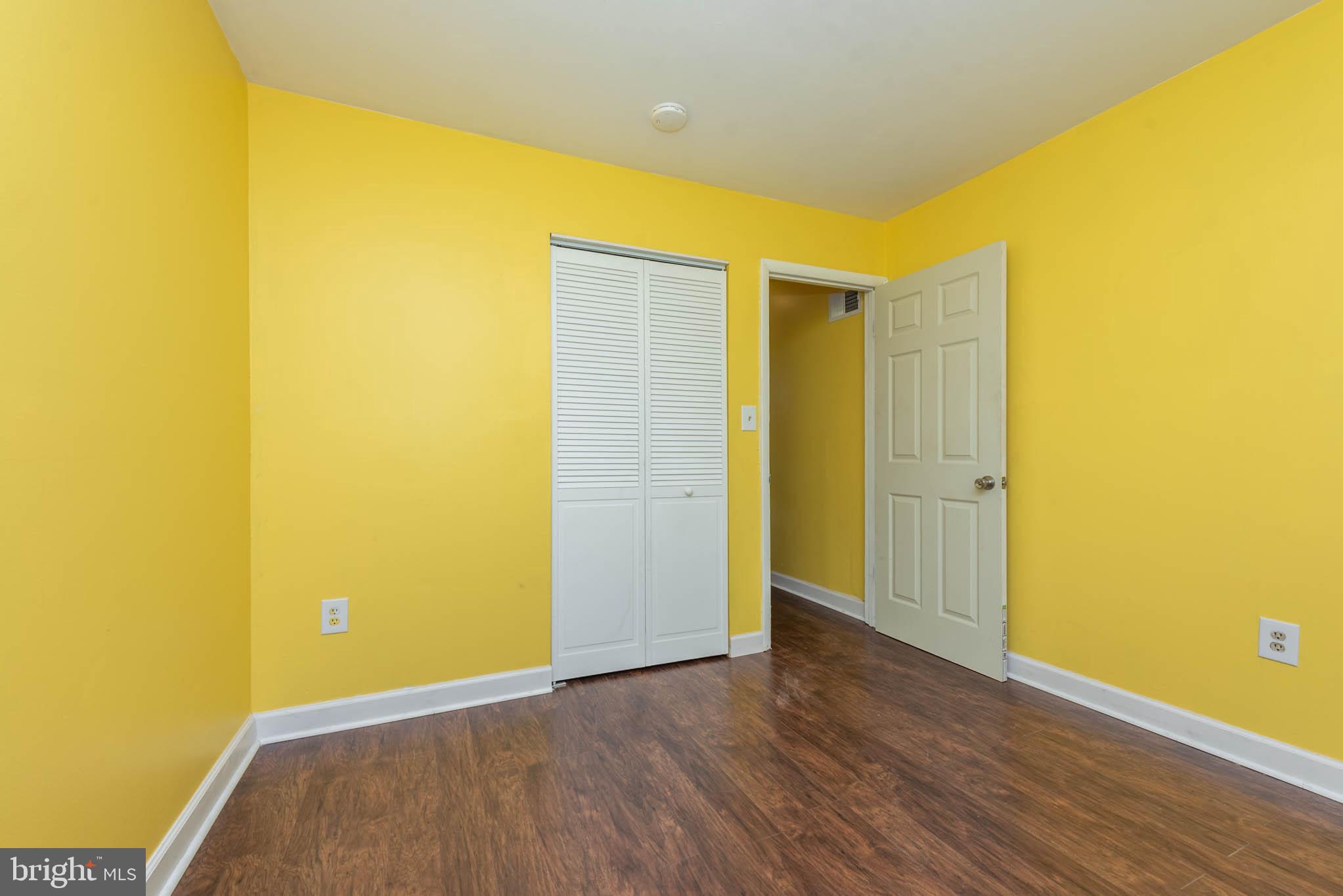 1737 North Dallas Street Baltimore, MD 21213 - Photo 7 of 14 a view of an empty room with wooden floor