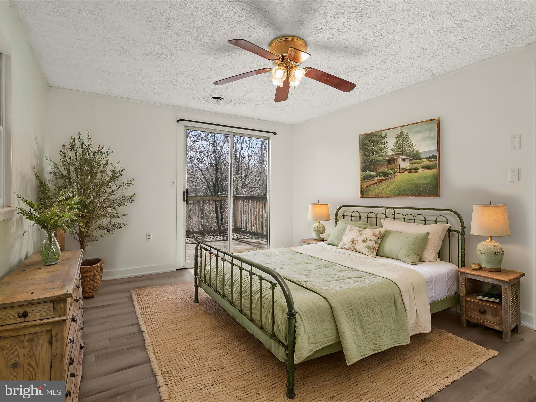 1970 Lower Marlboro Road Huntingtown, MD 20639 - Photo 34 of 81 a bedroom with a large bed and a potted plant