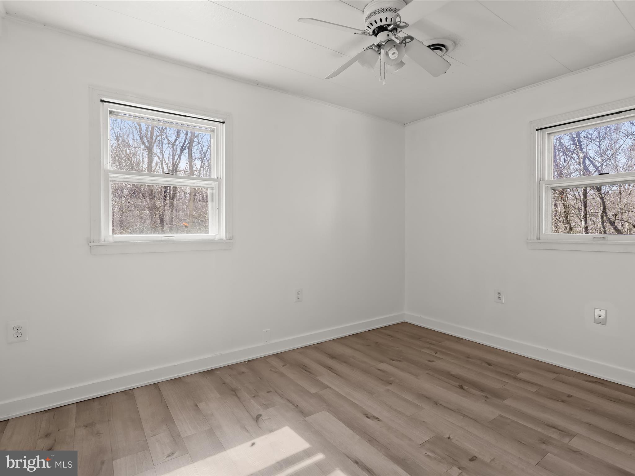1970 Lower Marlboro Road Huntingtown, MD 20639 - Photo 45 of 81 a view of an empty room with wooden floor and a window
