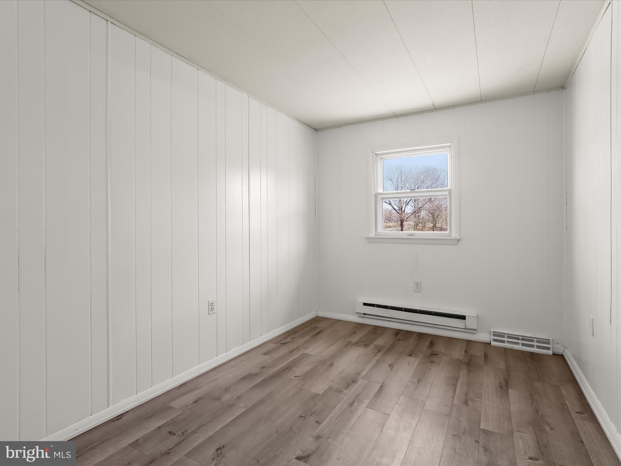 1970 Lower Marlboro Road Huntingtown, MD 20639 - Photo 48 of 81 an empty room with wooden floor and windows