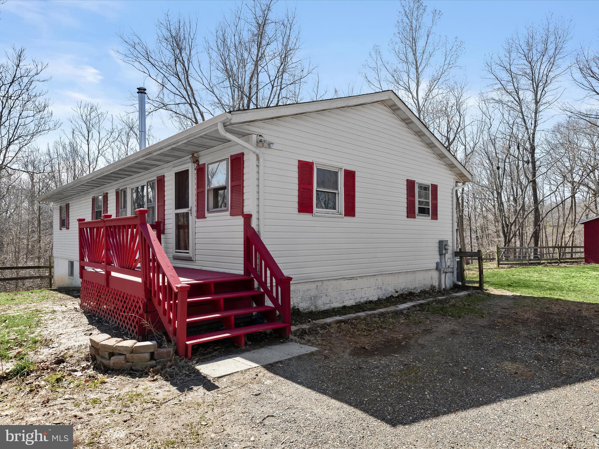 1970 Lower Marlboro Road Huntingtown, MD 20639 - Photo 6 of 81 a front view of a house with a yard
