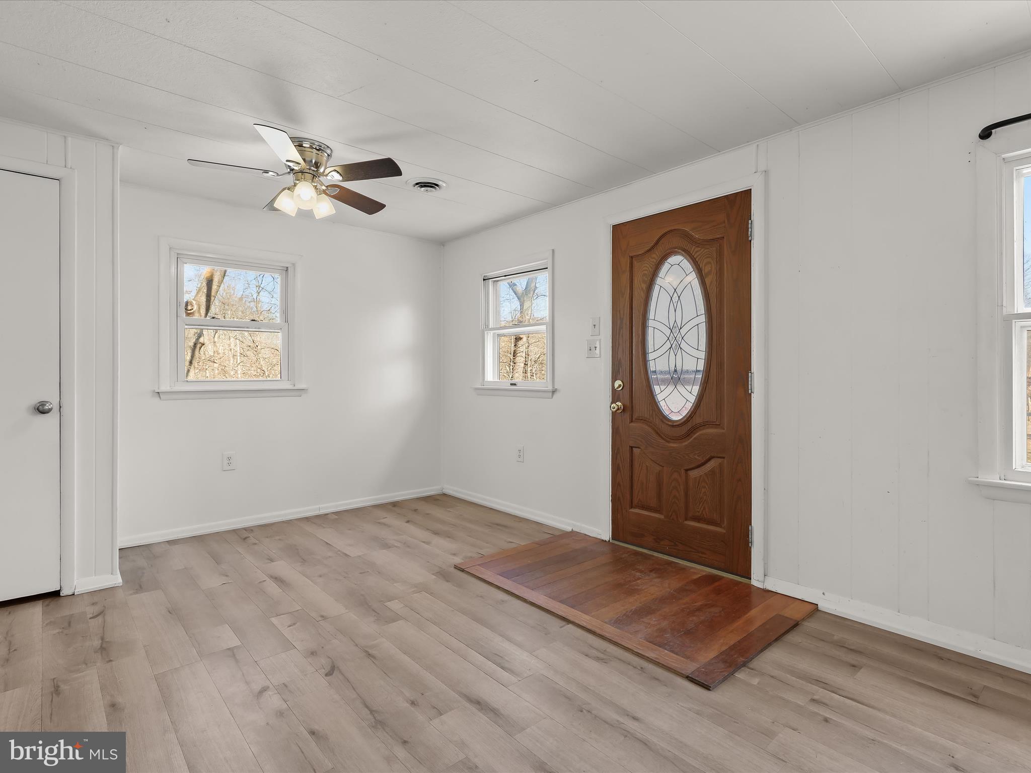 1970 Lower Marlboro Road Huntingtown, MD 20639 - Photo 9 of 81 a view of empty room with wooden floor and fan