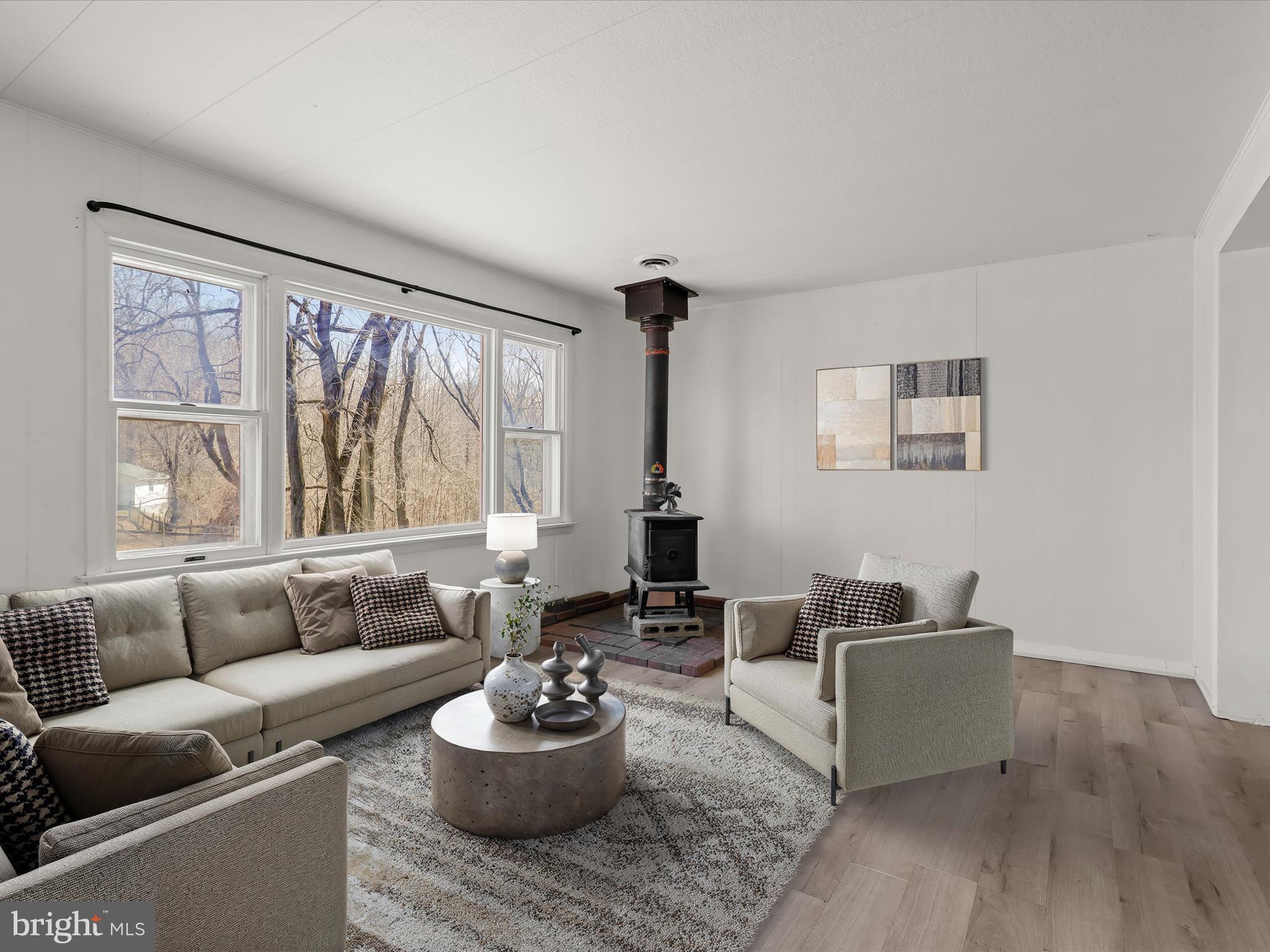 1970 Lower Marlboro Road Huntingtown, MD 20639 - Photo 10 of 81 a living room with furniture and a large window