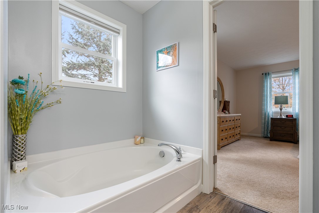 2542 Call Road Stow, OH 44224 - Photo 36 of 47 Bathroom with hardwood / wood-style floors and a tub to relax in