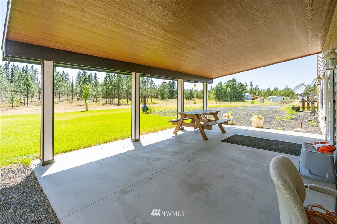 19922 South Smythe Road Spangle, WA 99031 - Photo 28 of 37 a view of a swimming pool and outdoor space
