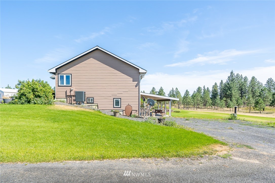 19922 South Smythe Road Spangle, WA 99031 - Photo 34 of 37 a view of a house with a yard and lake view