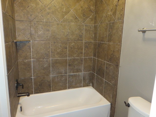 2607 Alan Lake Lane Spring, TX 77388 - Photo 26 of 42 a white bath tub sitting next to a white toilet