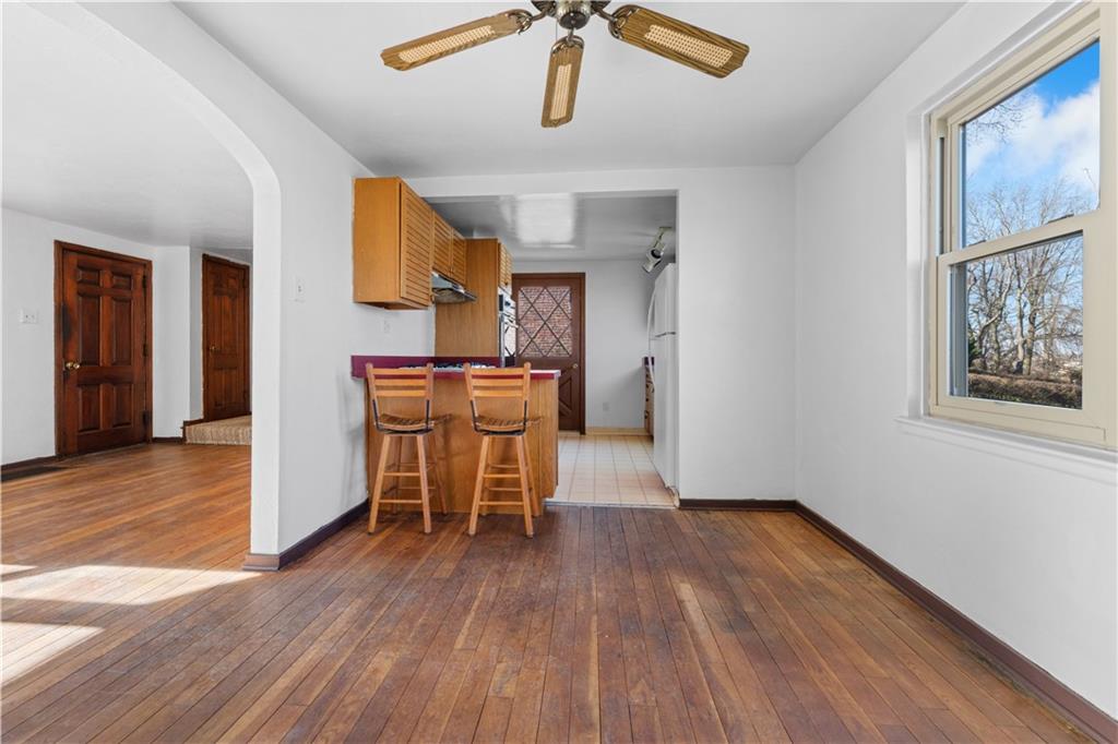 495 Highview Road Pittsburgh, PA 15234 - Photo 6 of 23 a view of a workspace with furniture and wooden floor