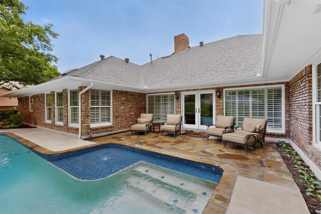 2405 Wing Point Lane Plano, TX 75093 - Photo 32 of 39 a backyard of a house with seating space