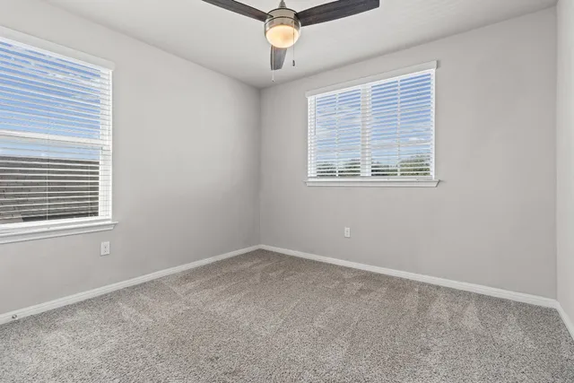 a view of a park with swings and slides