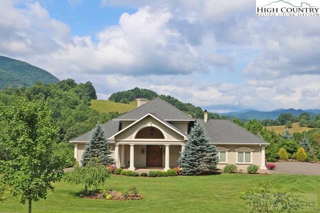 1352 West Deep Ford Road Lansing, NC 28643 - Photo 12 of 50 a front view of a house with garden