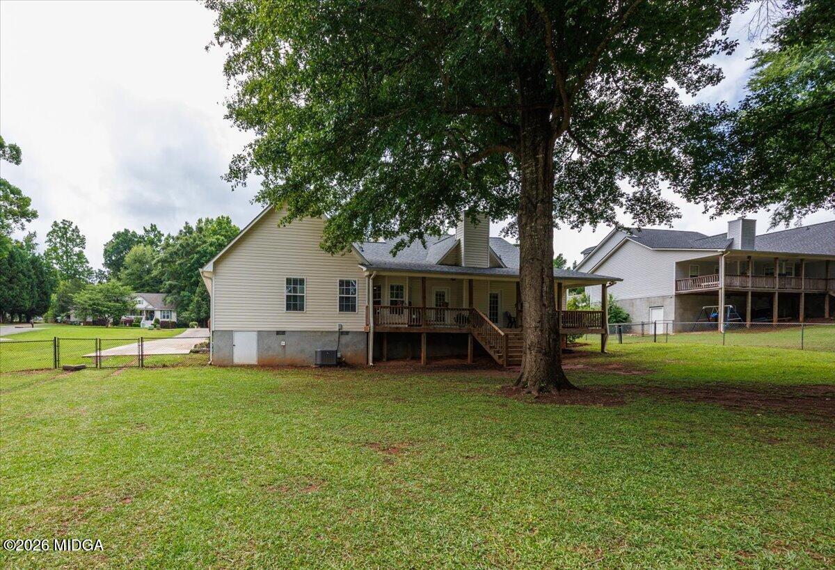 557 Aarons Circle Gray, GA 31032 - Photo 35 of 36 a view of a house with a yard