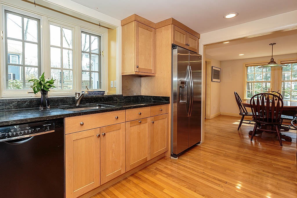 30 Munroe Road Lexington, MA 02421 - Photo 12 of 29 a kitchen with stainless steel appliances granite countertop a stove a sink and a refrigerator