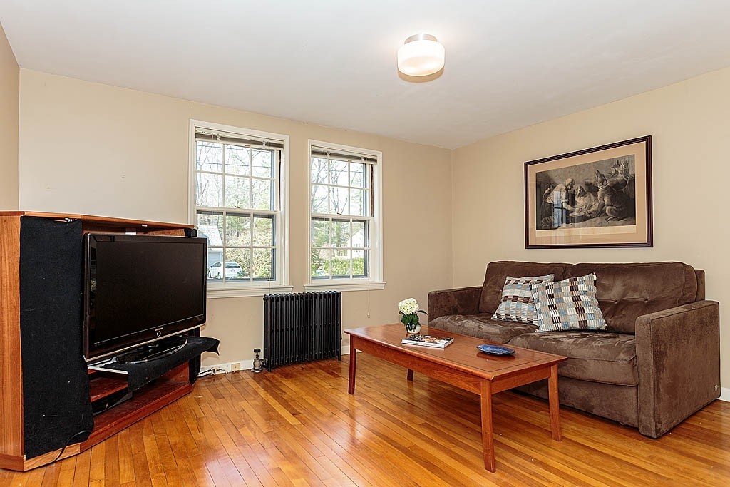 30 Munroe Road Lexington, MA 02421 - Photo 13 of 29 a living room with furniture and a flat screen tv