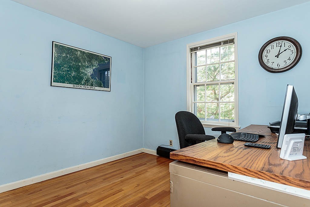 30 Munroe Road Lexington, MA 02421 - Photo 15 of 29 a view of a workspace with furniture and a window