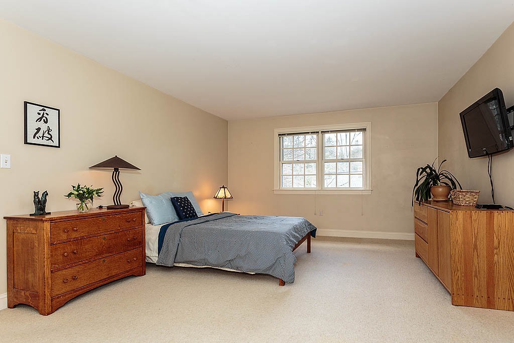30 Munroe Road Lexington, MA 02421 - Photo 17 of 29 a living room with furniture and a flat screen tv