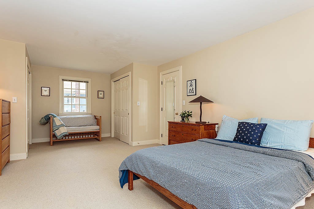 30 Munroe Road Lexington, MA 02421 - Photo 18 of 29 a bedroom with a bed and a window
