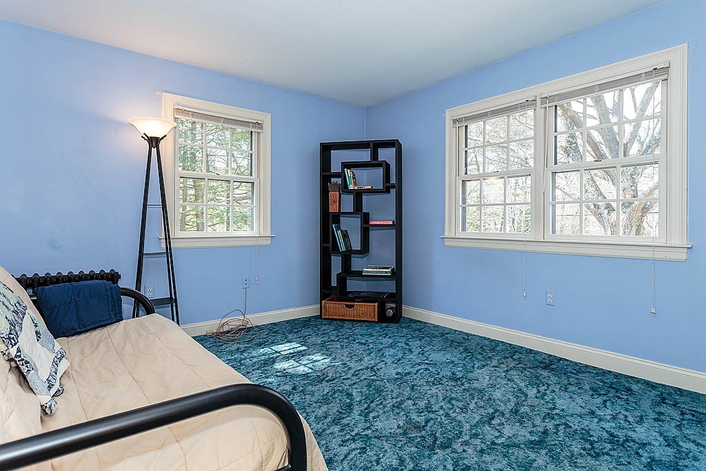 30 Munroe Road Lexington, MA 02421 - Photo 19 of 29 a bedroom with a bed and a window