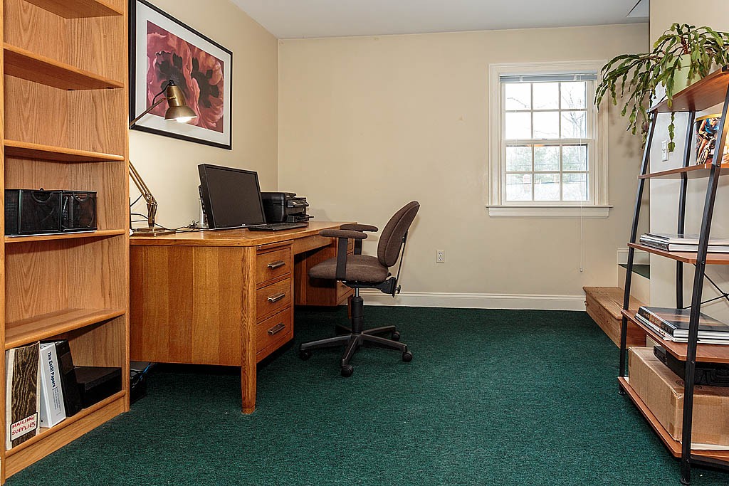 30 Munroe Road Lexington, MA 02421 - Photo 22 of 29 a view of a workspace with furniture and a window