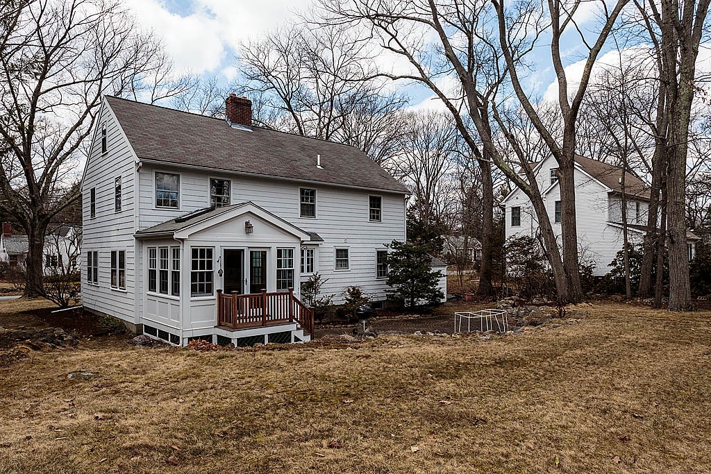 30 Munroe Road Lexington, MA 02421 - Photo 27 of 29 a house that has a tree in front of it