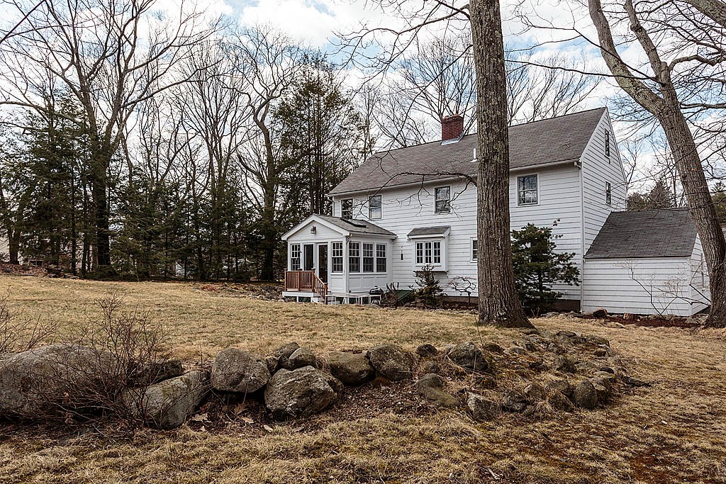 30 Munroe Road Lexington, MA 02421 - Photo 28 of 29 a view of a house with a yard covered in snow