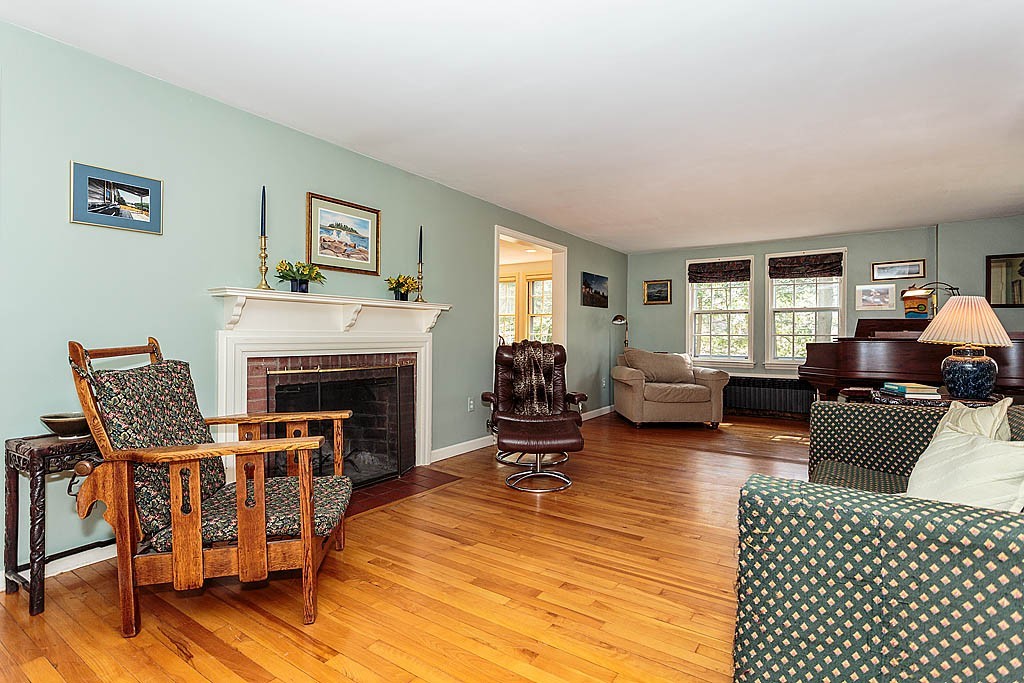 30 Munroe Road Lexington, MA 02421 - Photo 3 of 29 a living room with furniture and a fireplace