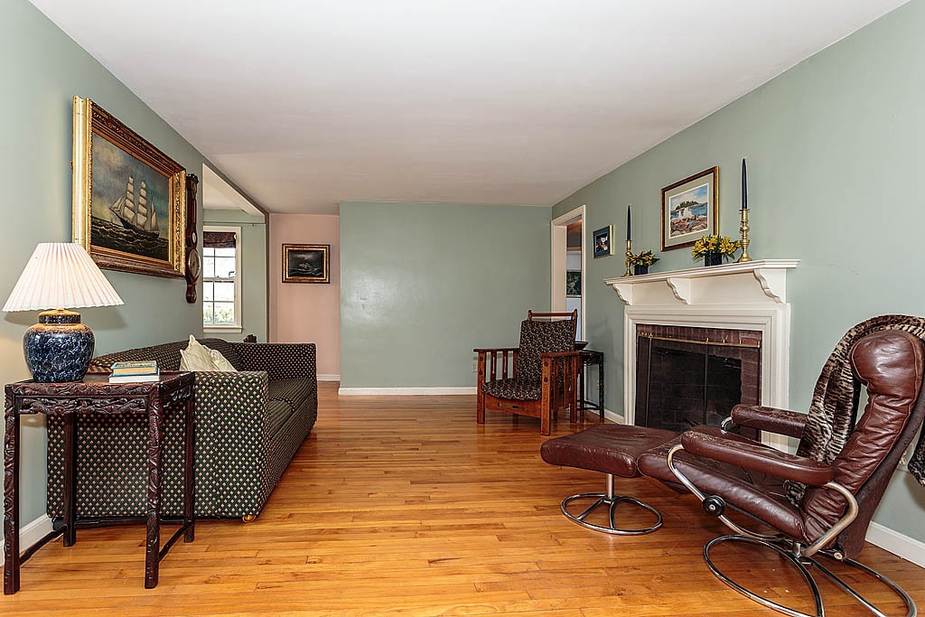 30 Munroe Road Lexington, MA 02421 - Photo 5 of 29 a living room with furniture and a fireplace