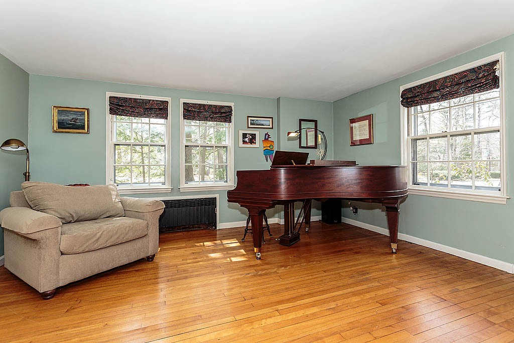 30 Munroe Road Lexington, MA 02421 - Photo 6 of 29 a living room with furniture a table and a window