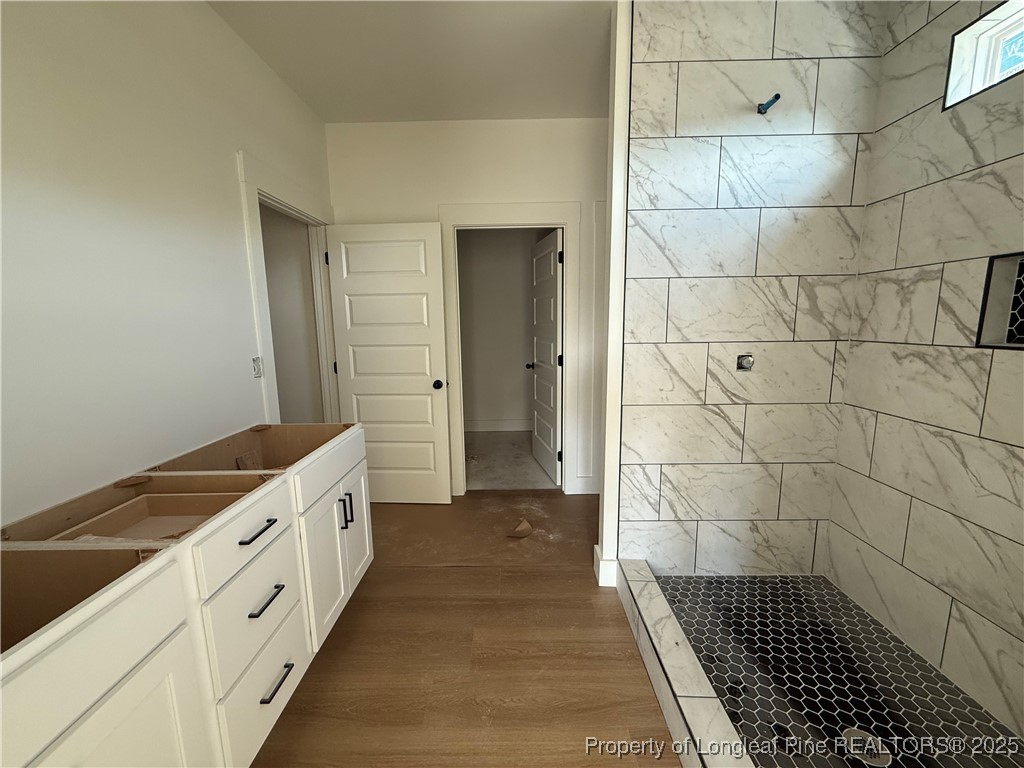 2080 Canady Pond Road Hope Mills, NC 28348 - Photo 11 of 20 a bathroom with a sink a toilet and a shower