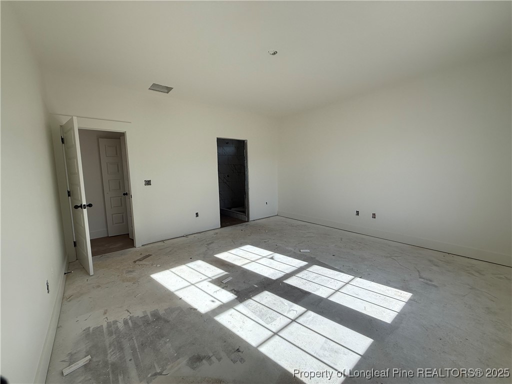 2080 Canady Pond Road Hope Mills, NC 28348 - Photo 17 of 20 a view of a big room with wooden floor and windows