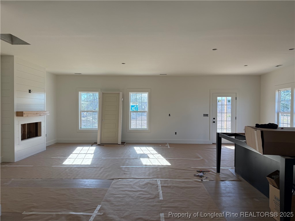 2080 Canady Pond Road Hope Mills, NC 28348 - Photo 5 of 20 a view of empty room with window and fireplace