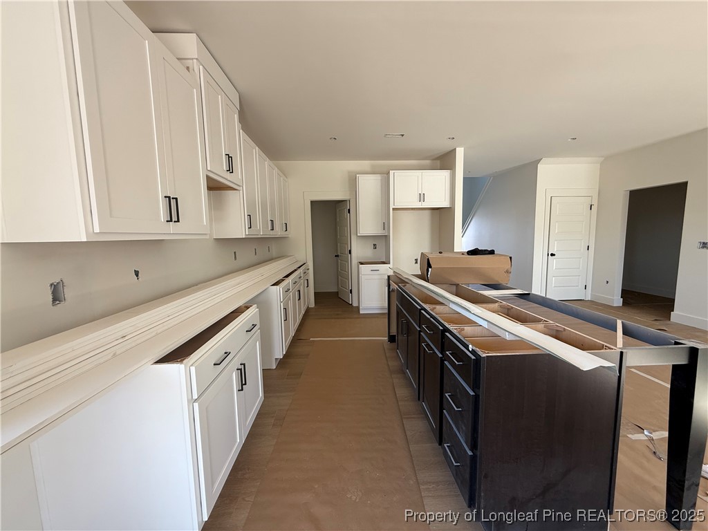 2080 Canady Pond Road Hope Mills, NC 28348 - Photo 7 of 20 a kitchen with stainless steel appliances a sink stove and cabinets