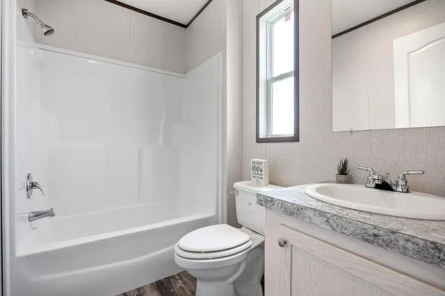 a bathroom with a sink toilet and bathtub