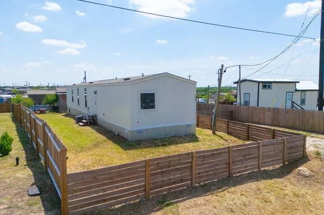 a view of a backyard with couches chair