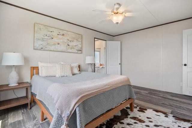 a bed room with a bed and a lamp