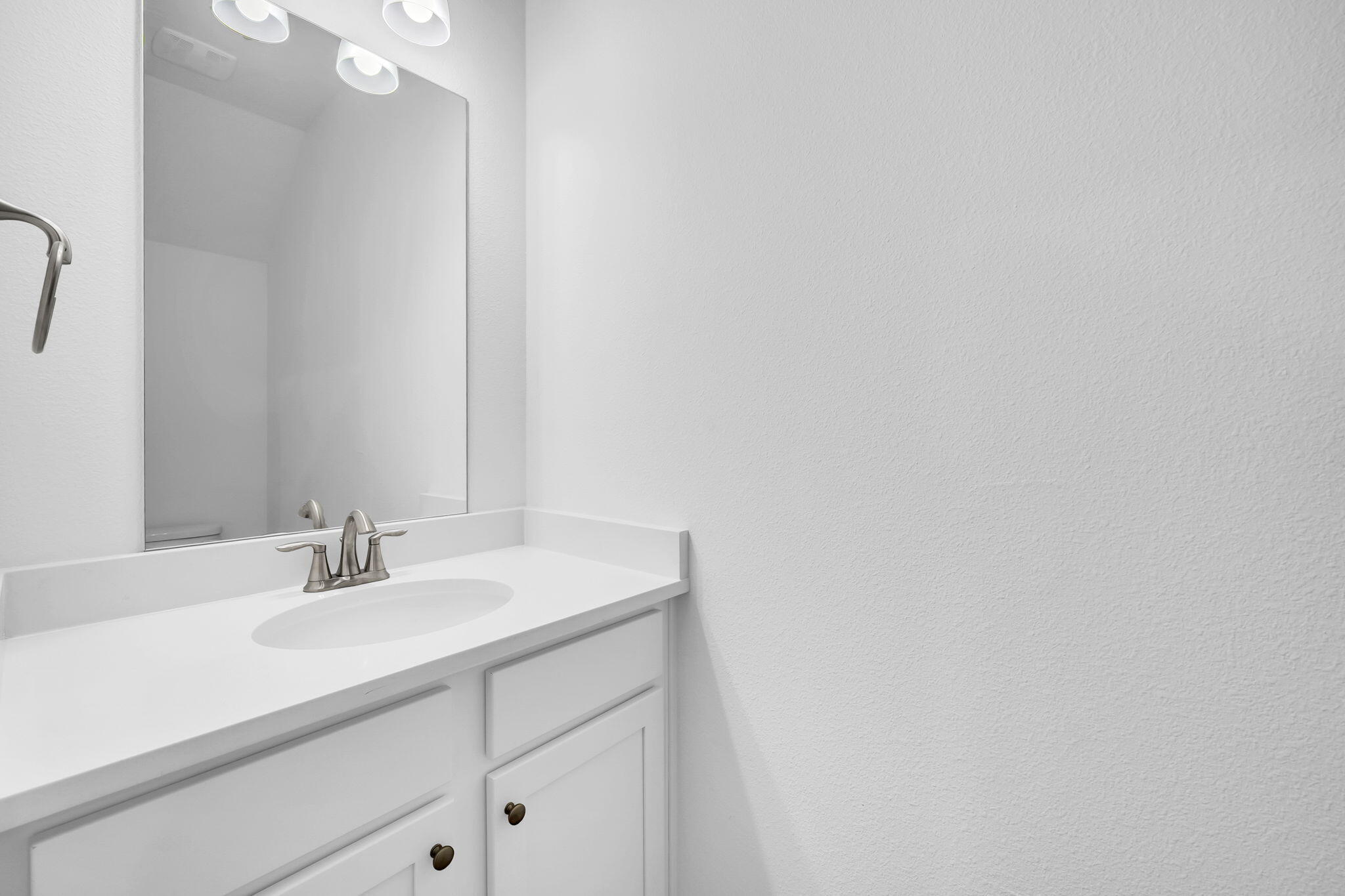 22 Redbird Loop Destin, FL 32541 - Photo 16 of 40 a bathroom with a sink and a mirror