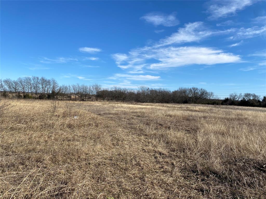 310 South May Street Whitewright, TX 75491 - Photo 2 of 8 a view of a lake view