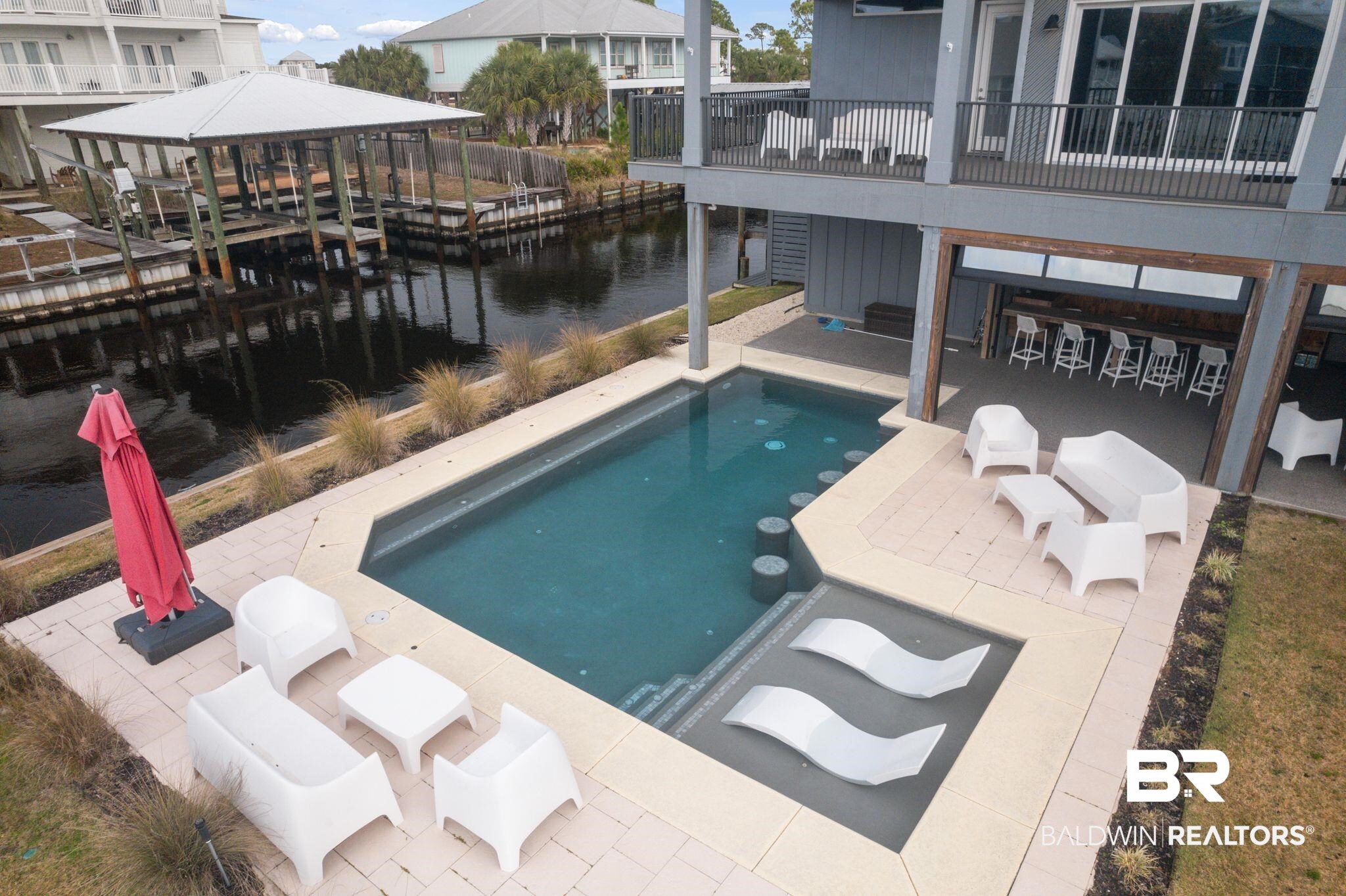 3840 Cotton Way Orange Beach, AL 36561 - Photo 64 of 75 View of swimming pool featuring a patio and a water view