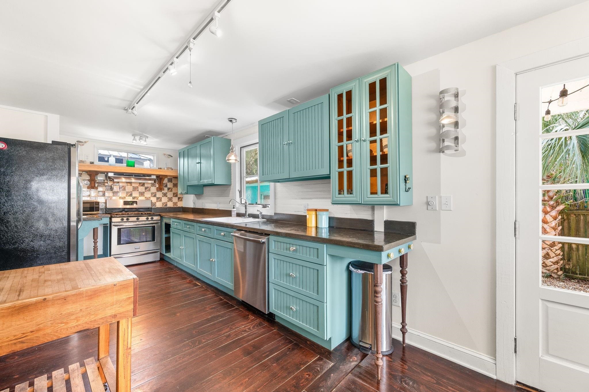 73 Kings Ferry Way St. Augustine, FL 32084 - Photo 20 of 71 a kitchen with stainless steel appliances granite countertop a stove and cabinets