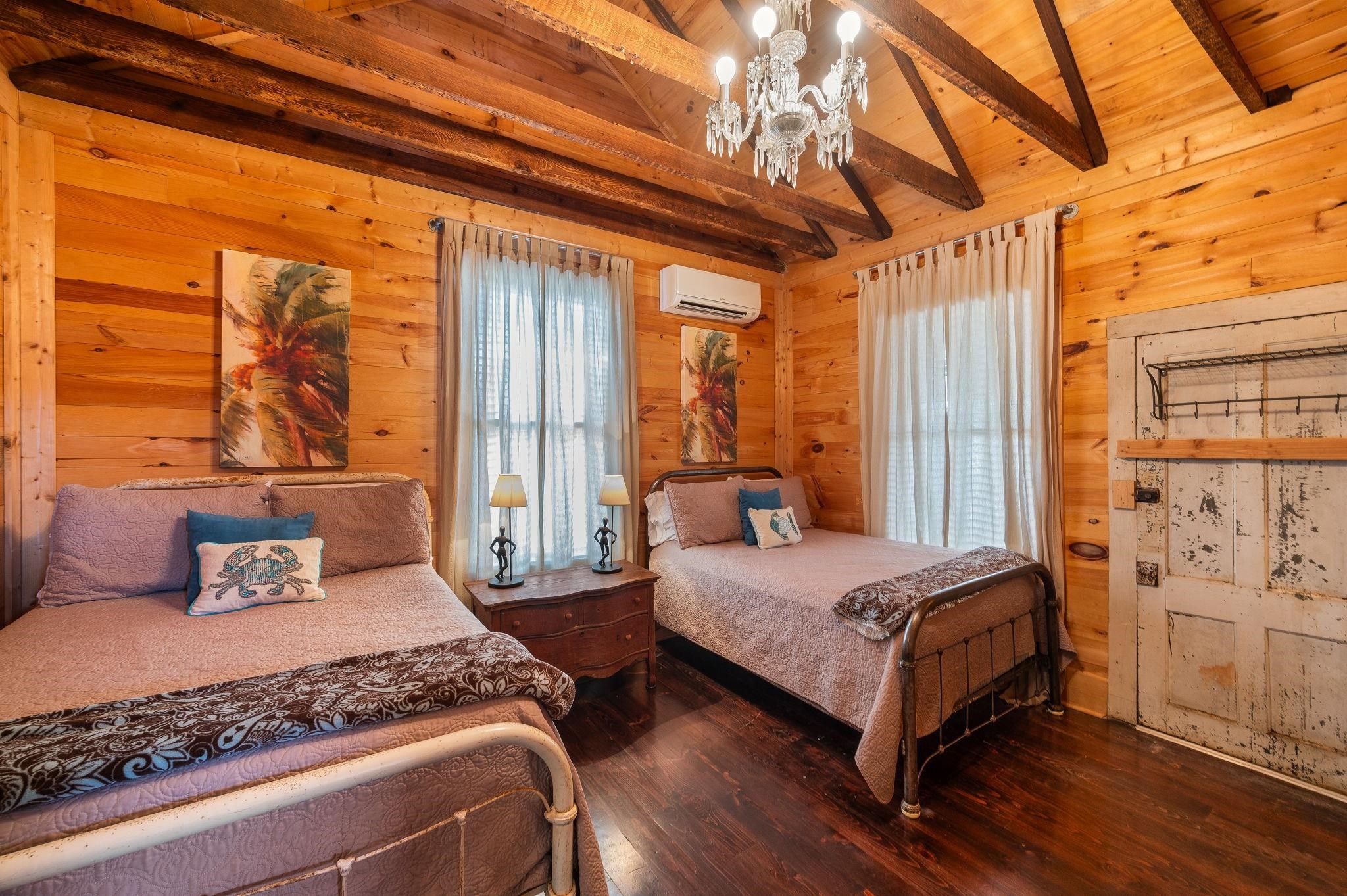 73 Kings Ferry Way St. Augustine, FL 32084 - Photo 29 of 71 a bedroom with a bed and wooden floor