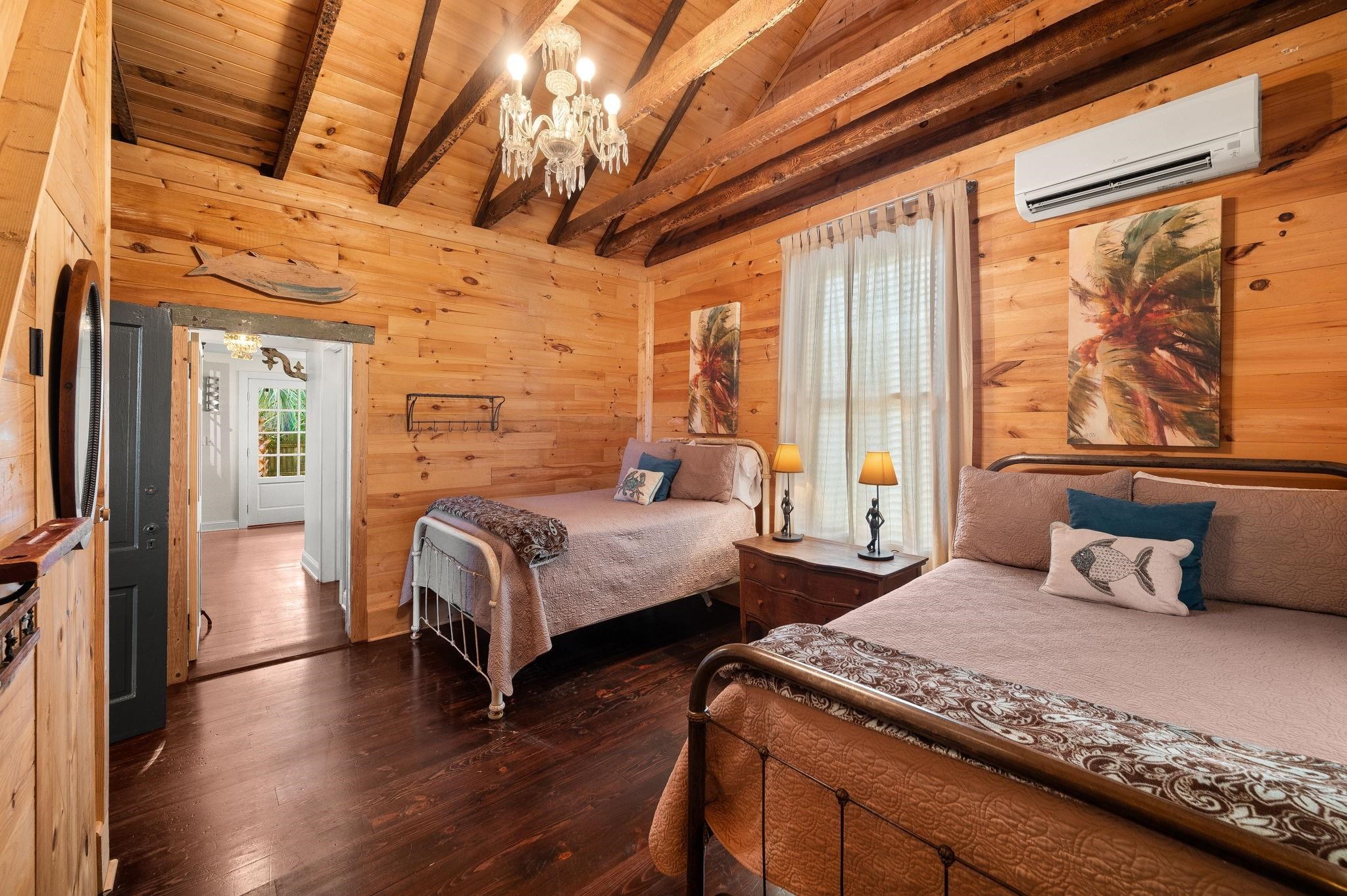 73 Kings Ferry Way St. Augustine, FL 32084 - Photo 33 of 71 a bedroom with a bed and wooden floor