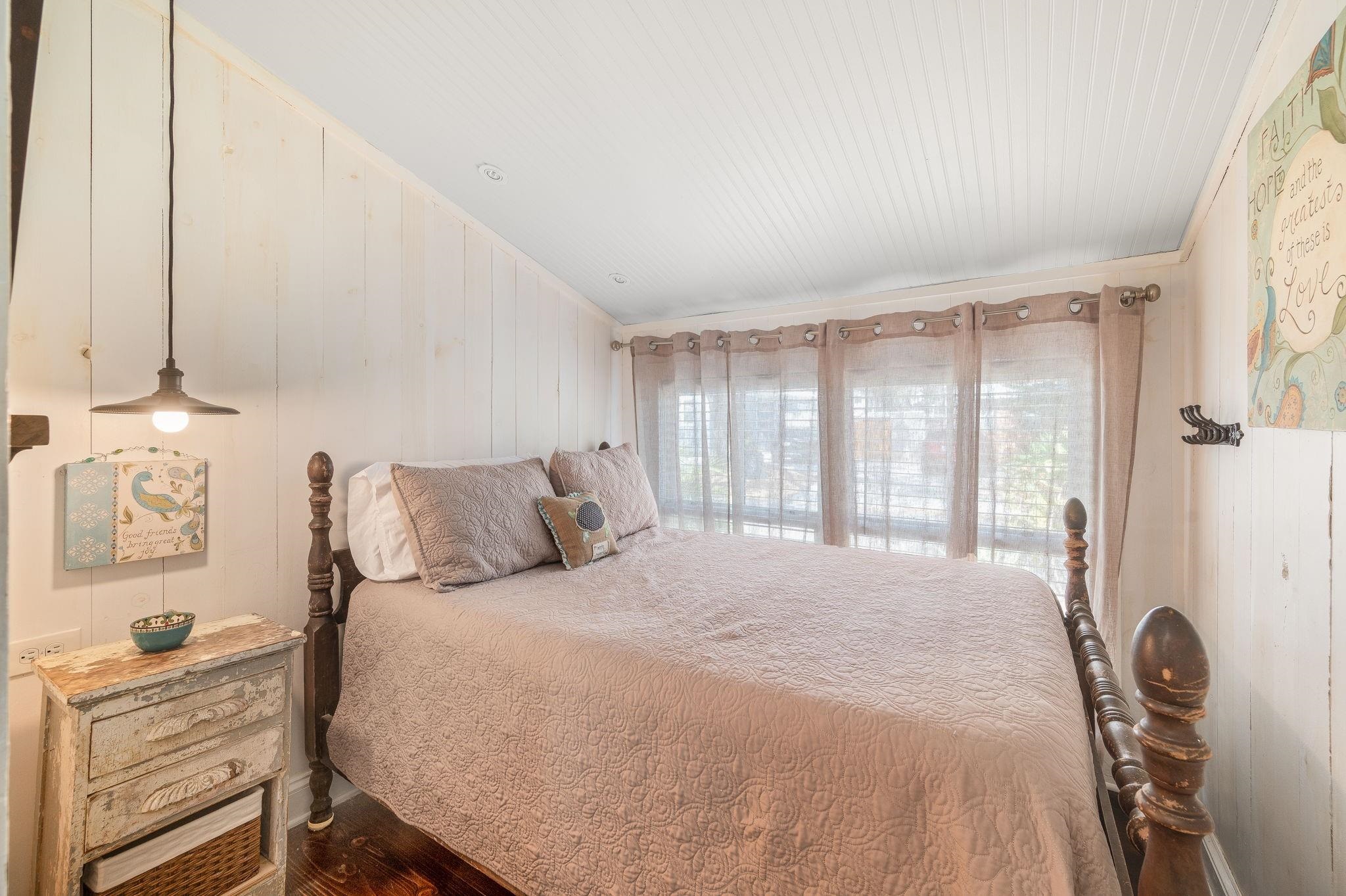 73 Kings Ferry Way St. Augustine, FL 32084 - Photo 38 of 71 a bedroom with a bed and a window