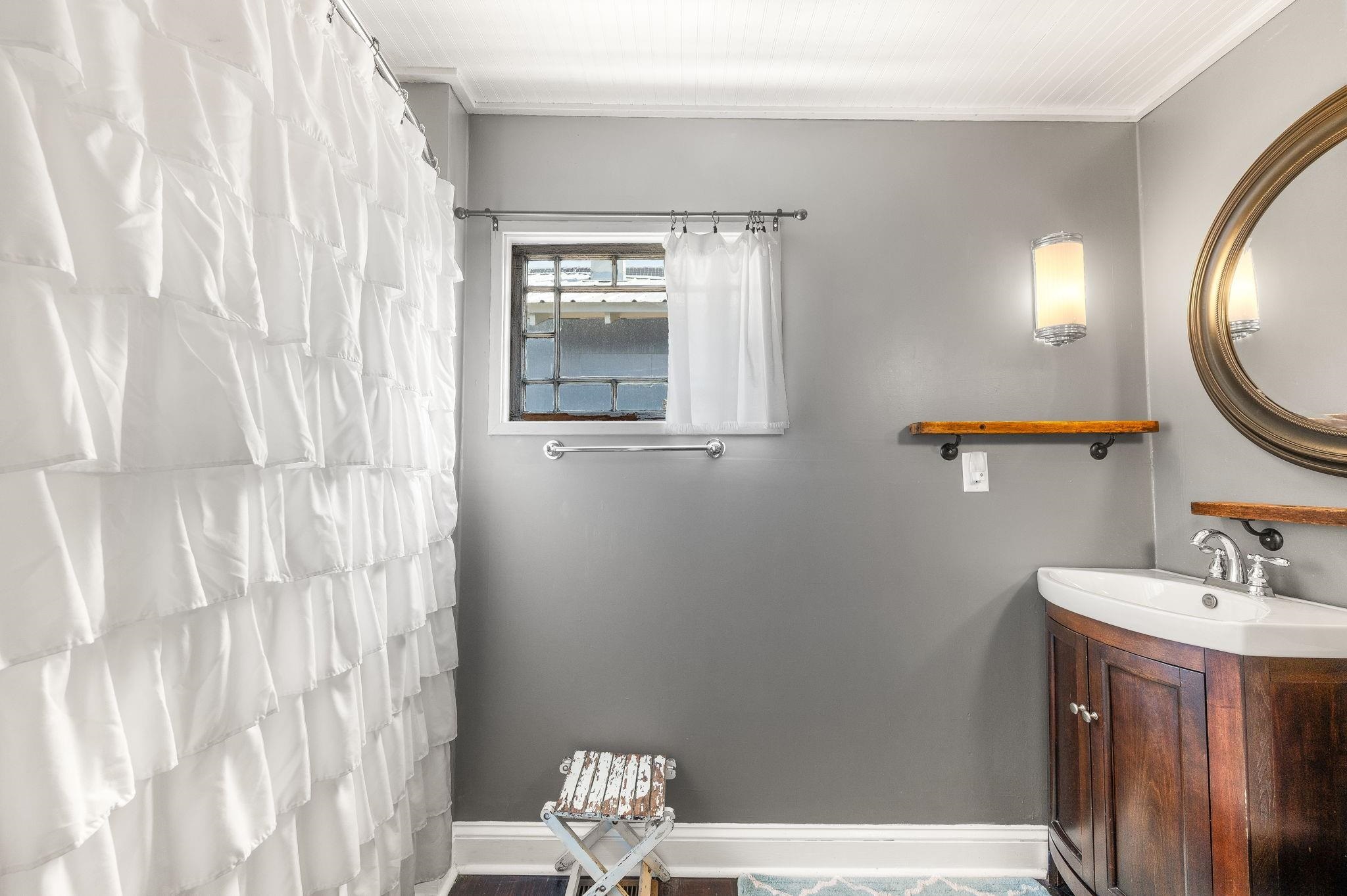 73 Kings Ferry Way St. Augustine, FL 32084 - Photo 41 of 71 a bathroom with a sink a mirror and a toilet