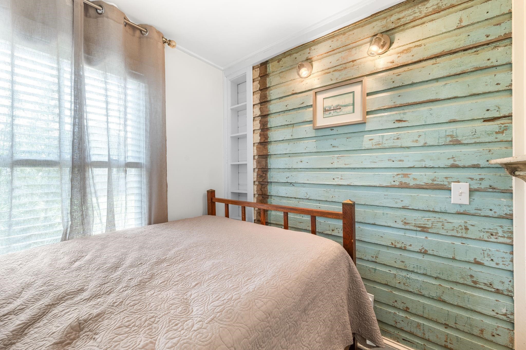 73 Kings Ferry Way St. Augustine, FL 32084 - Photo 46 of 71 a bedroom with a bed and large windows