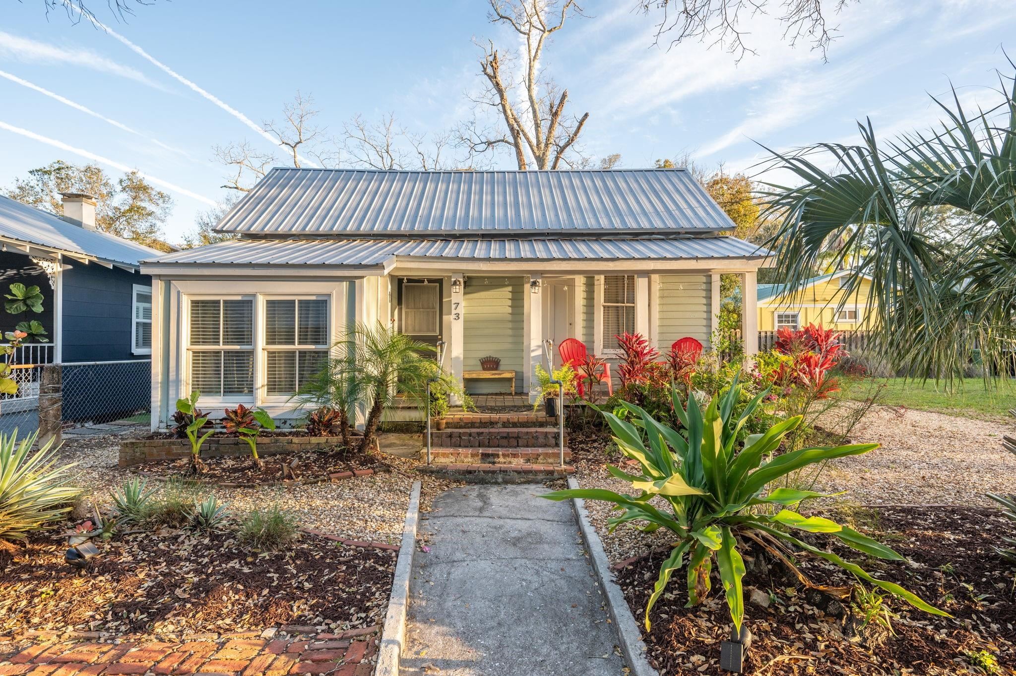 73 Kings Ferry Way St. Augustine, FL 32084 - Photo 65 of 71 a front view of a house with garden