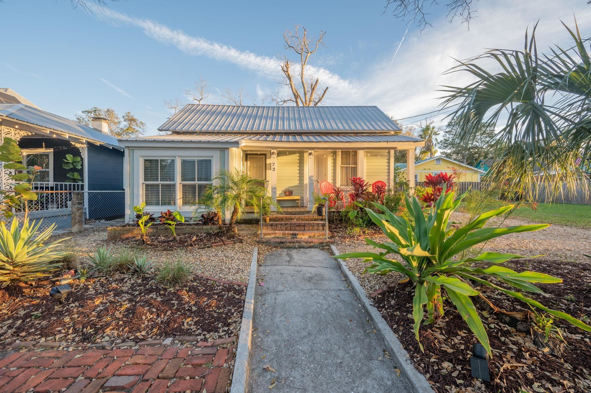 73 Kings Ferry Way St. Augustine, FL 32084 - Photo 66 of 71 a view of a house with fountain couches and potted plants