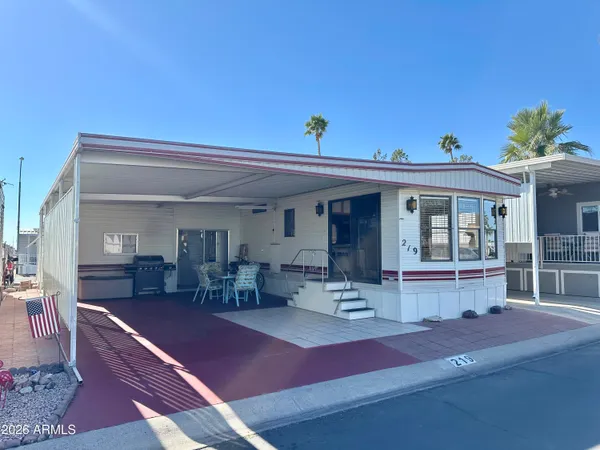 a front view of house with outdoor seating