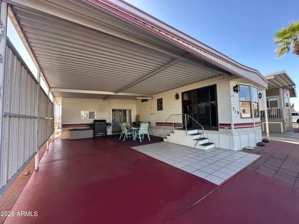 a view of a porch with furniture and a flat screen tv