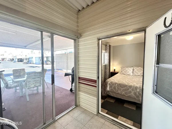 a room with wooden floor and furniture