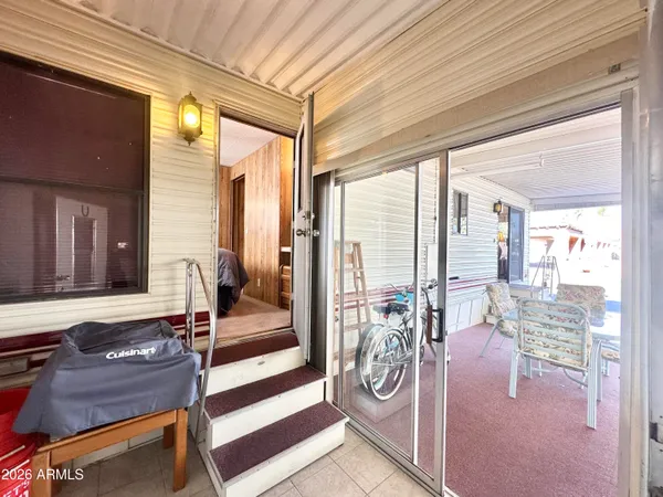 a bedroom with a bed and a mirror